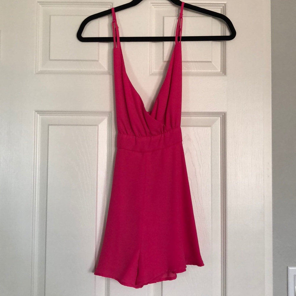 Hot pink plunge v neck romper with crisscross back